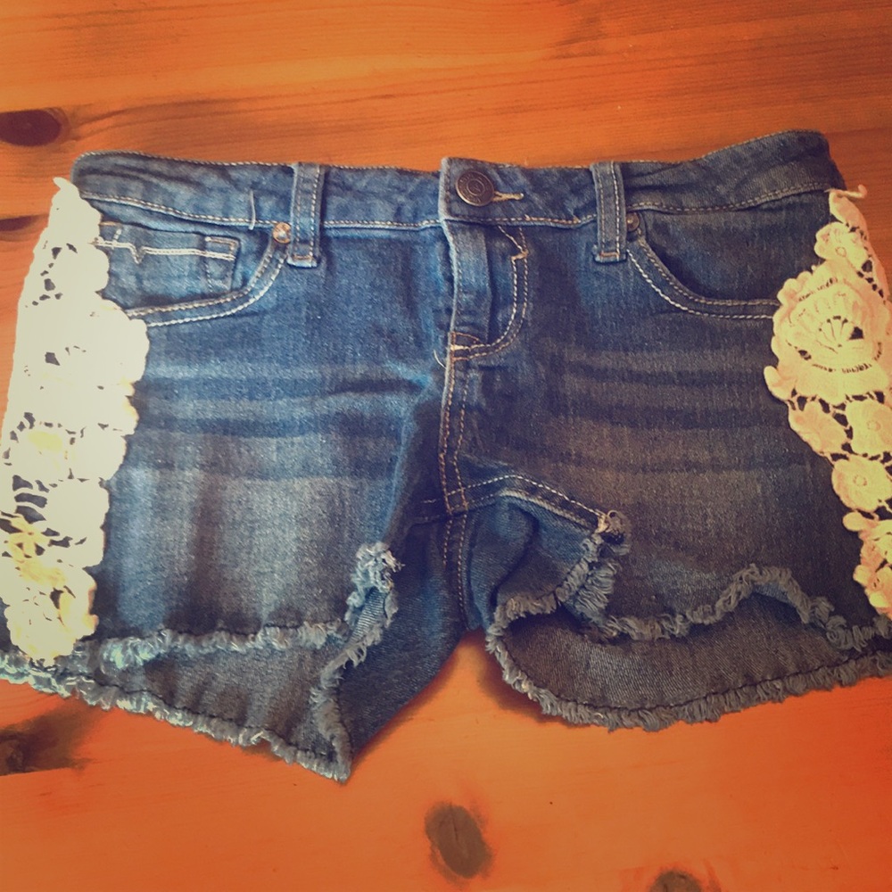 Denim jean shorts with flowers on the sides